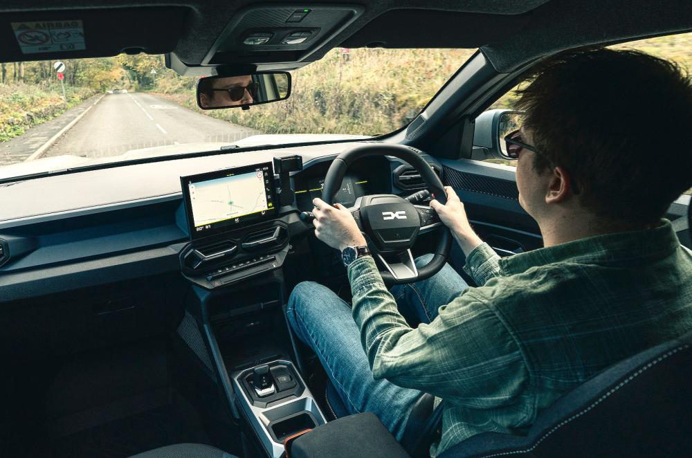 Oliver Young test driving Dacia Duster