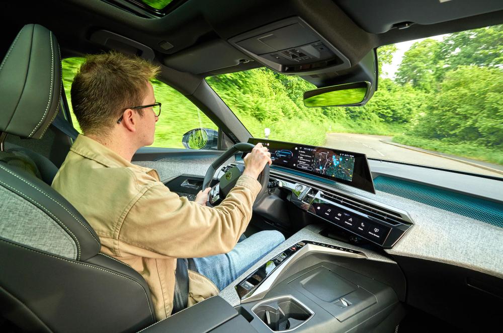 Oliver Young test driving Peugeot E-3008