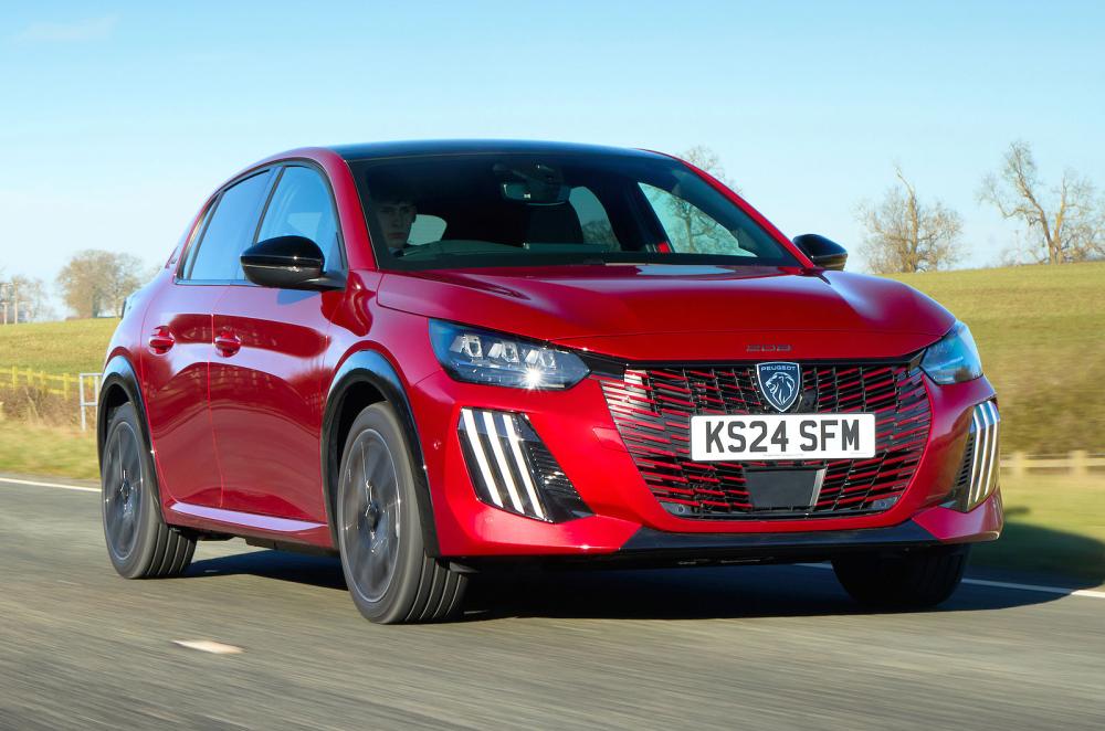 Red Peugeot 208 front right driving