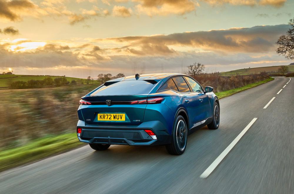 Blue Peugeot 408 rear right driving