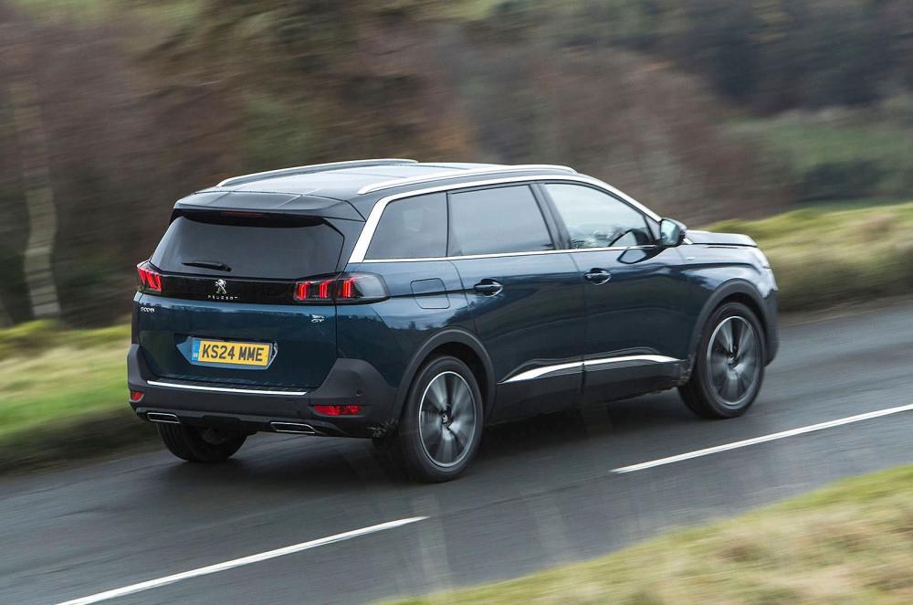 Blue Peugeot 5008 rear right driving