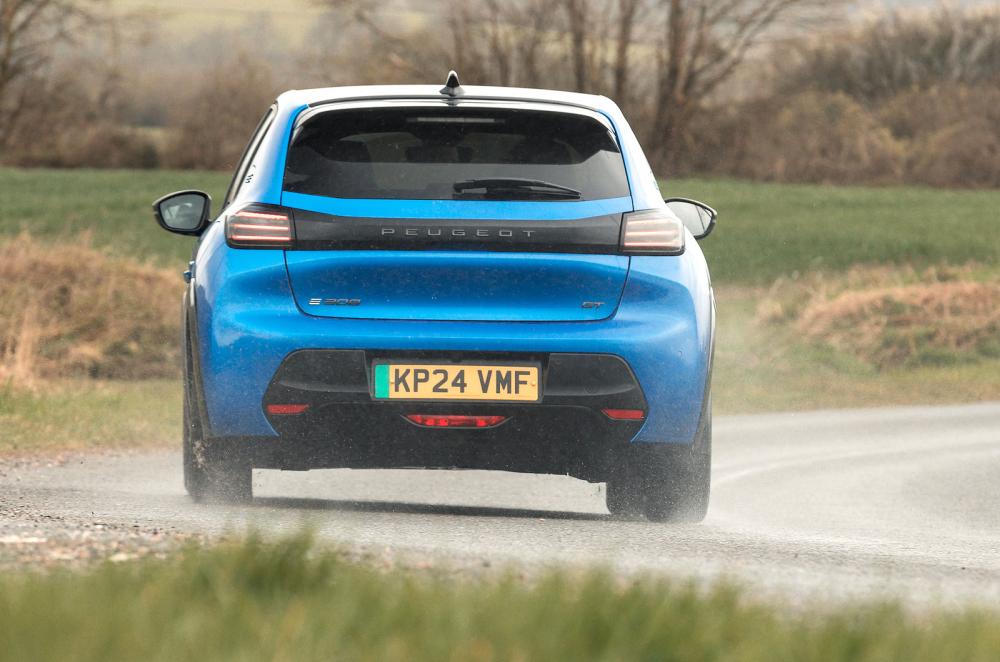 Blue Peugeot e-208 rear cornering