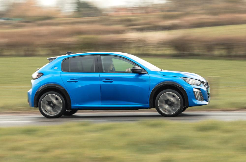 Blue Peugeot e-208 right driving