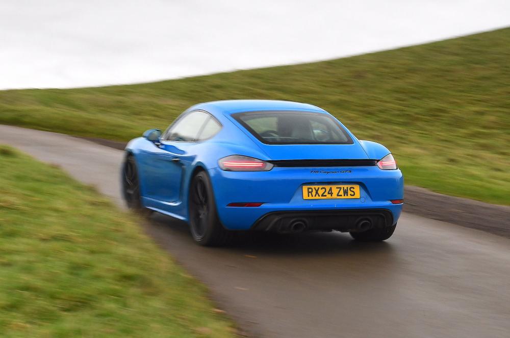 Porsche 718 Cayman rear left driving