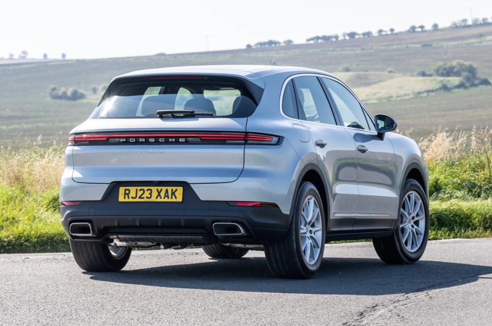 Porsche Cayenne driving rear corner