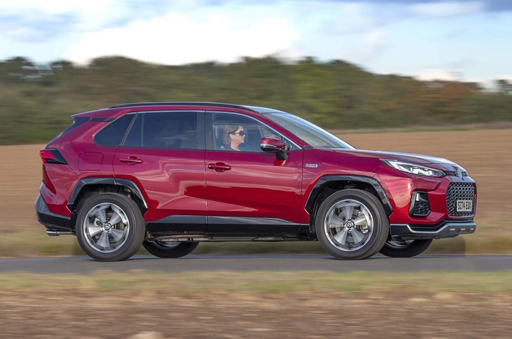 Suzuki Across side left driving red