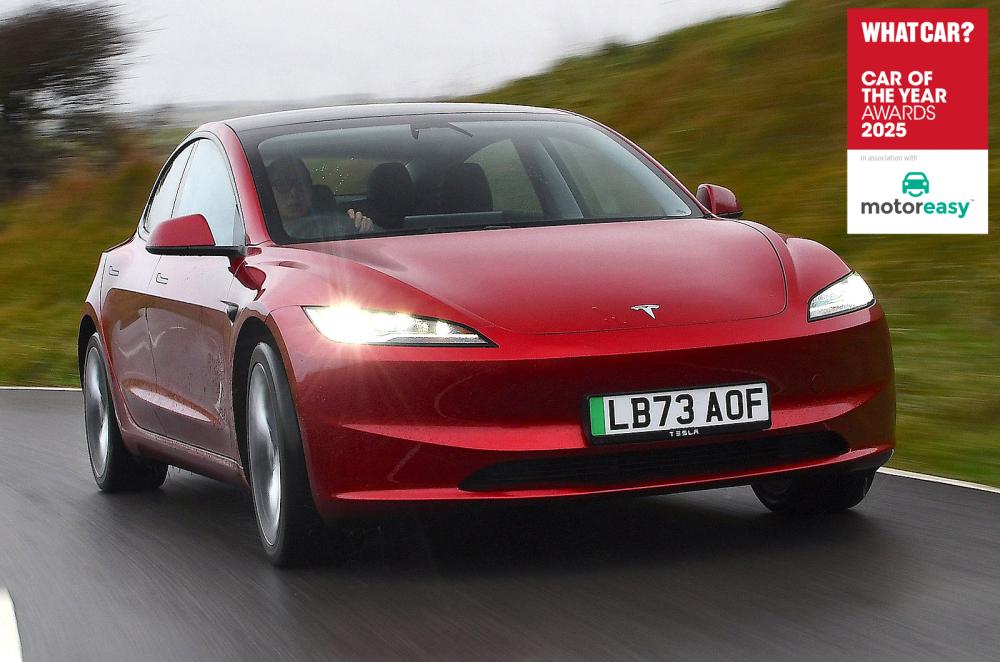 Tesla Model 3 front right driving