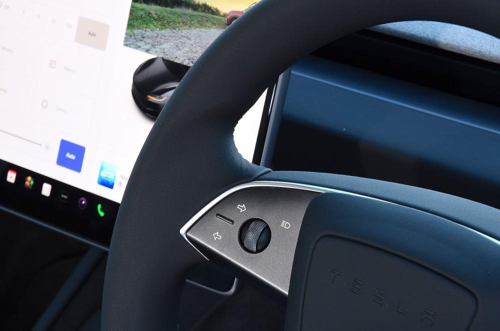 Tesla Model 3 interior steering wheel detail