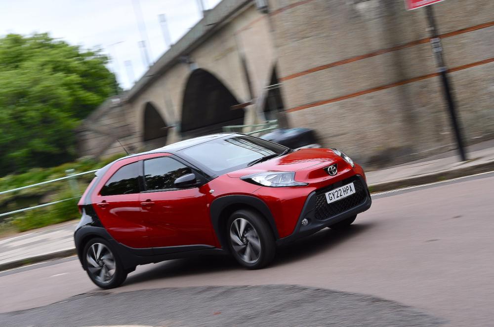 Red Toyota Aygo X front cornering