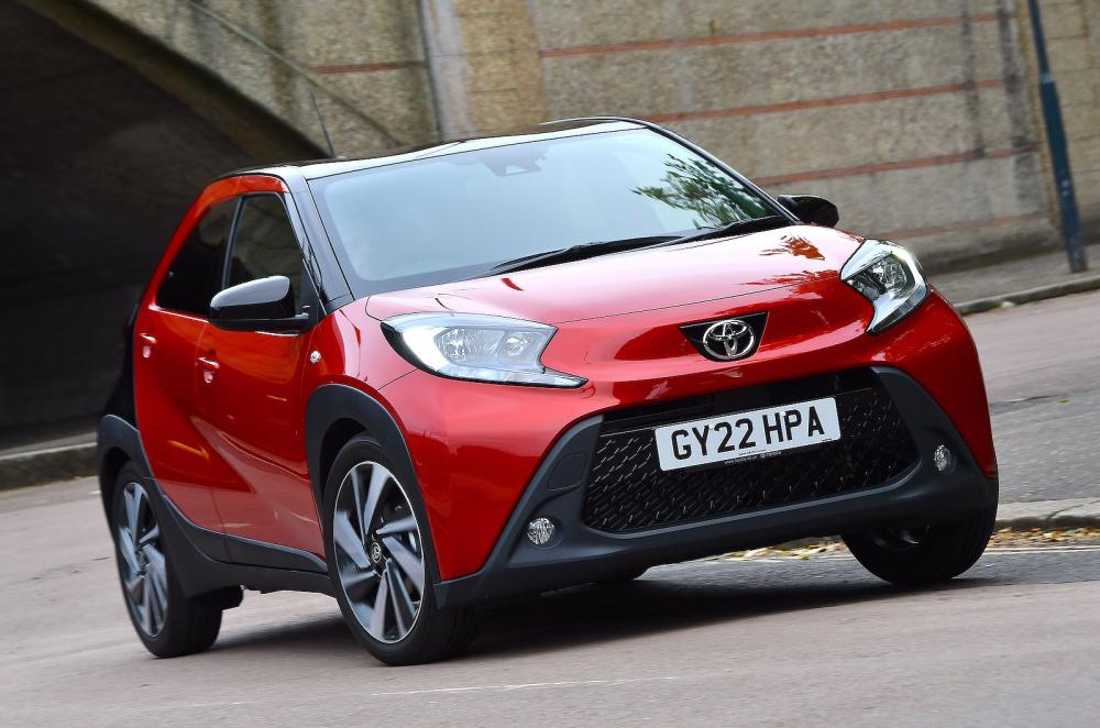 Red Toyota Aygo X front cornering