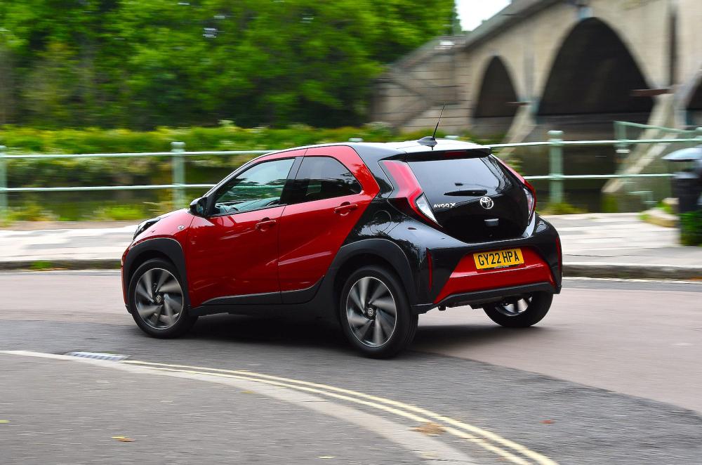 Red Toyota Aygo X rear cornering