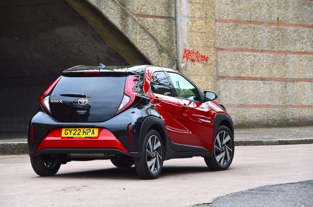 Red Toyota Aygo X rear cornering
