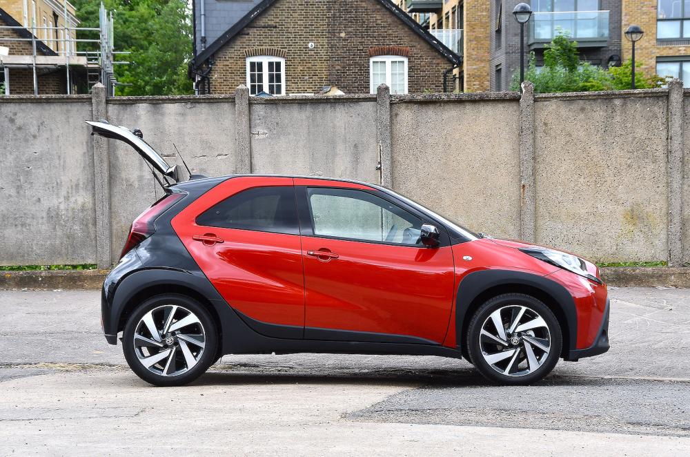 Red Toyota Aygo X right static boot open