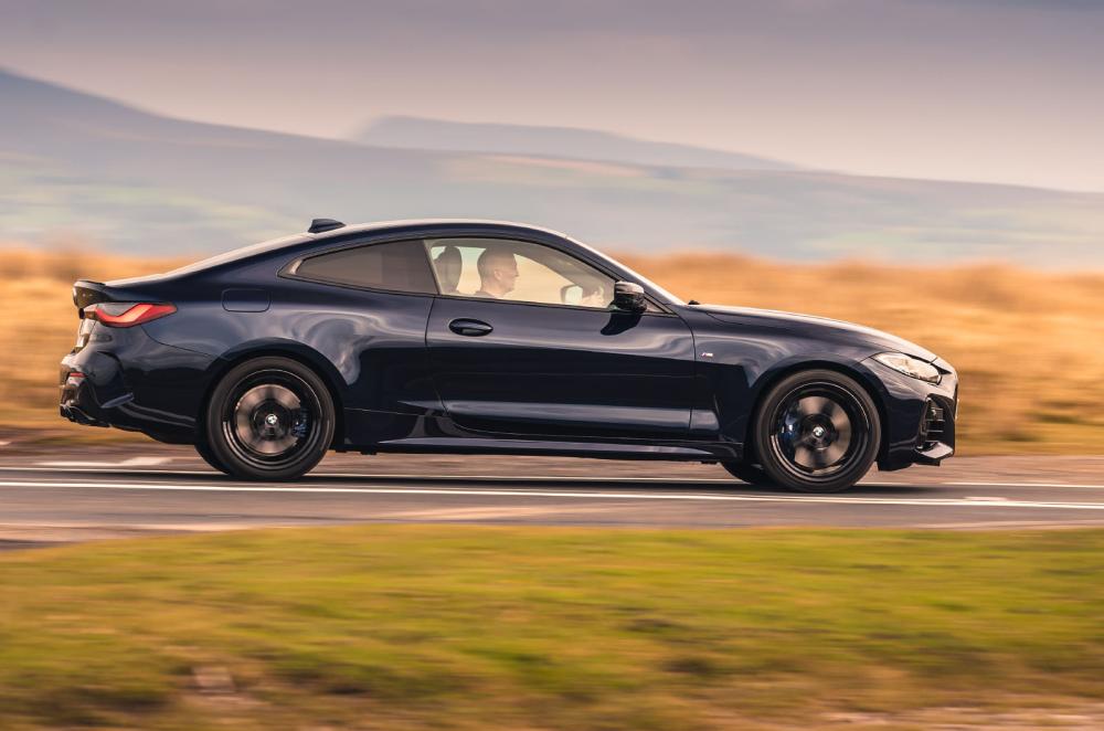 Used BMW 4 Series Coupé 2021-present side driving