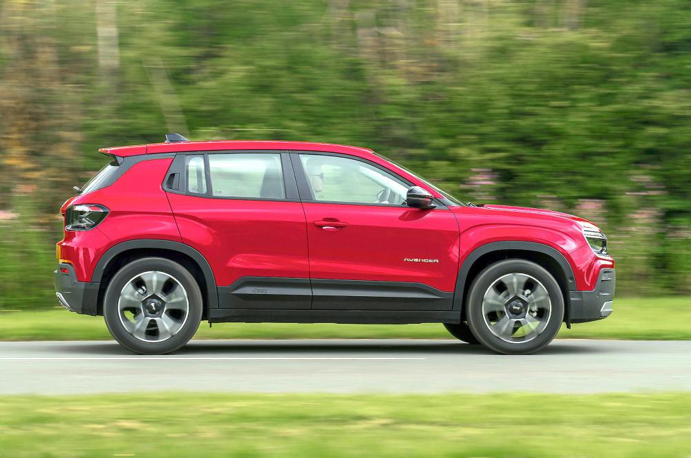 Used Jeep Avenger 2023-present side driving red