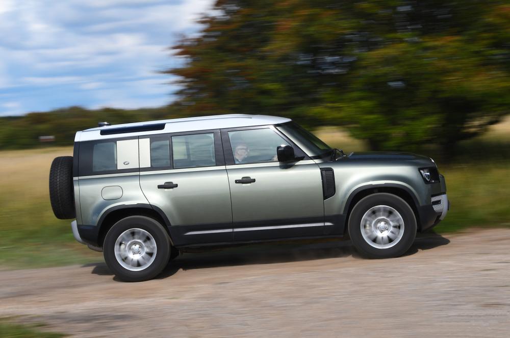 Used Land Rover Defender 2020-present side driving green