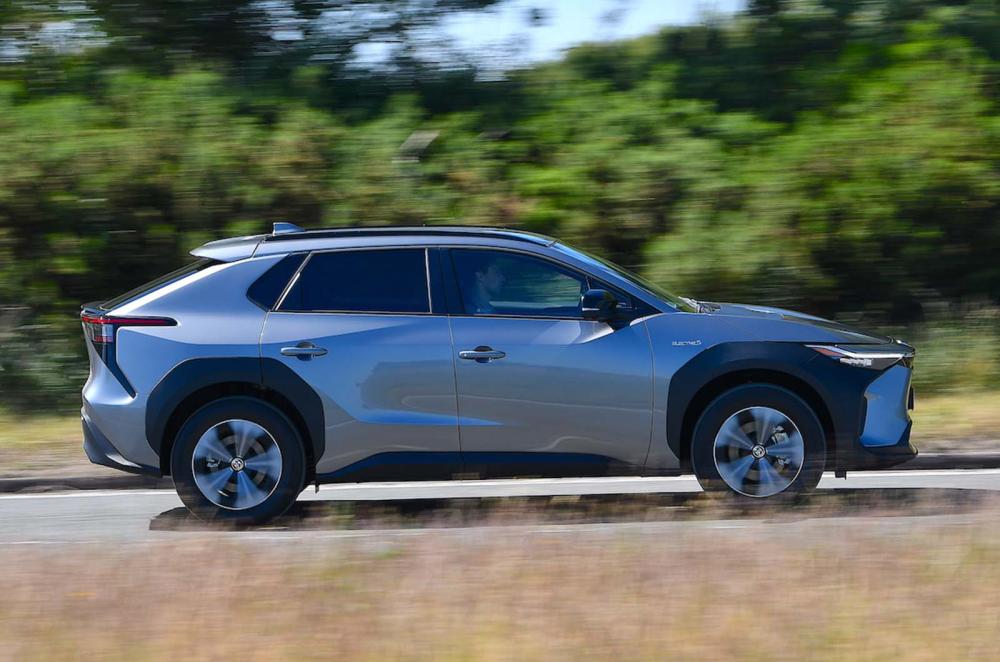 Used Toyota bZ4X 2022-present side driving grey