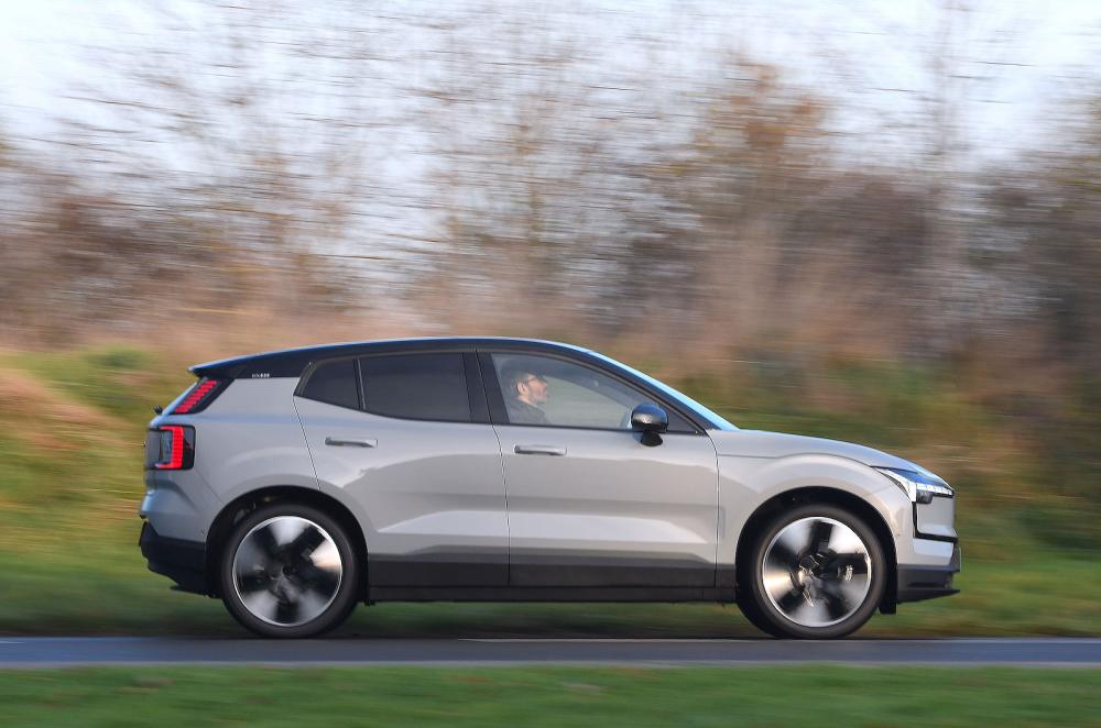 Used Volvo EX30 2023-present side driving grey