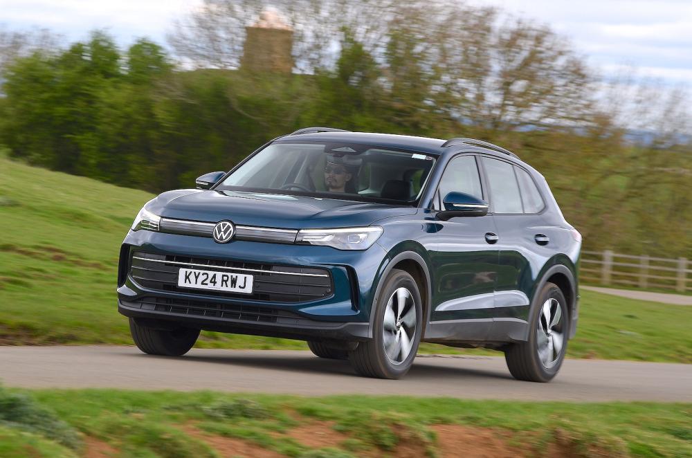 Blue VW Tiguan front left driving