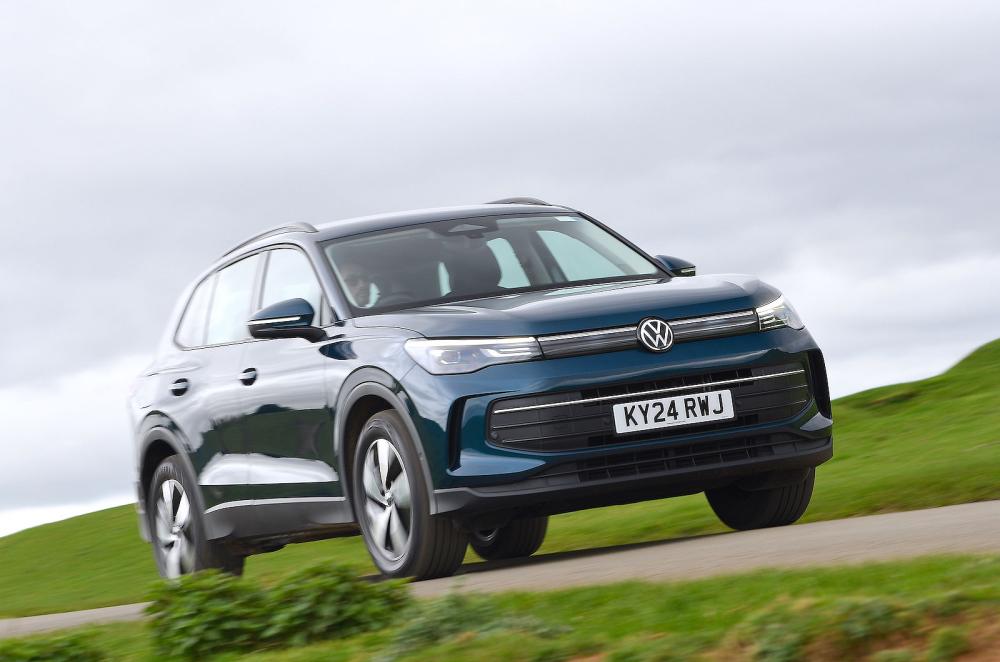 Blue VW Tiguan front right driving