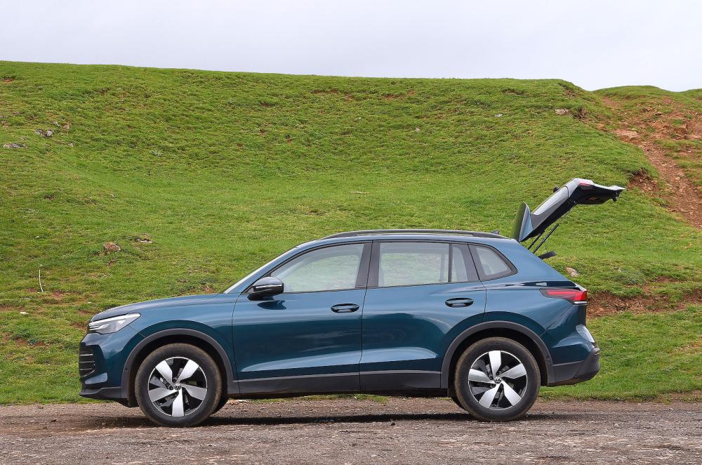 Blue VW Tiguan left static boot open