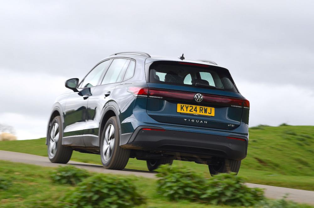 Blue VW Tiguan rear left driving