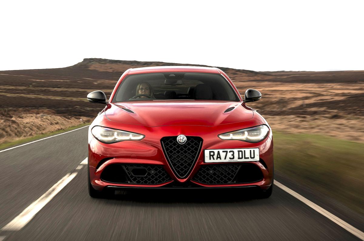 Red Alfa Romeo Giulia Quadrifoglio front driving