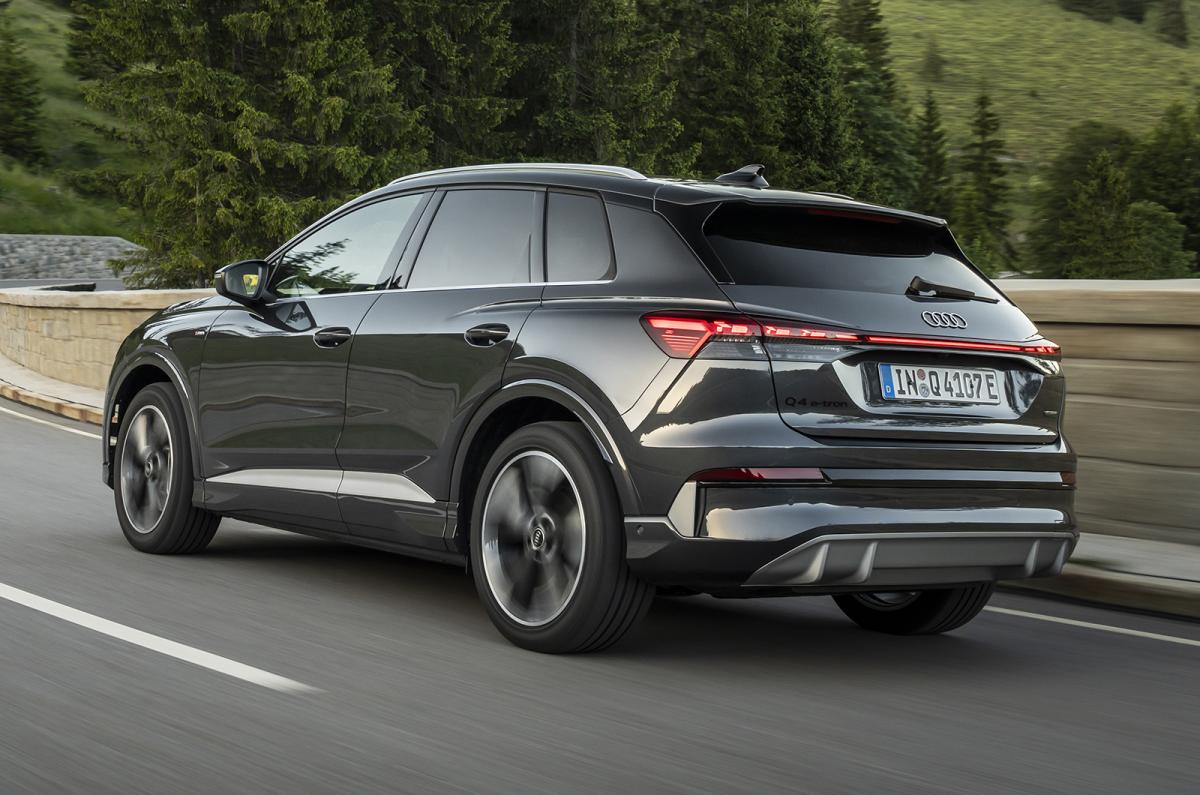 Audi Q4 e-tron driving rear left