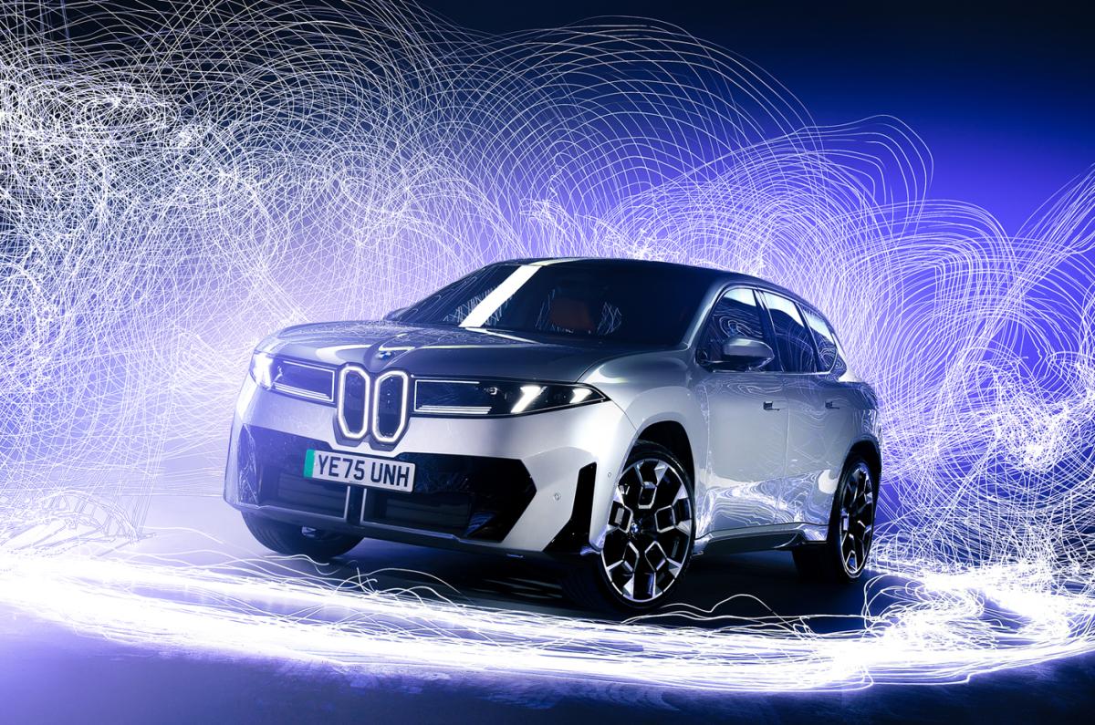 BMW iX3 front static surrounded by light