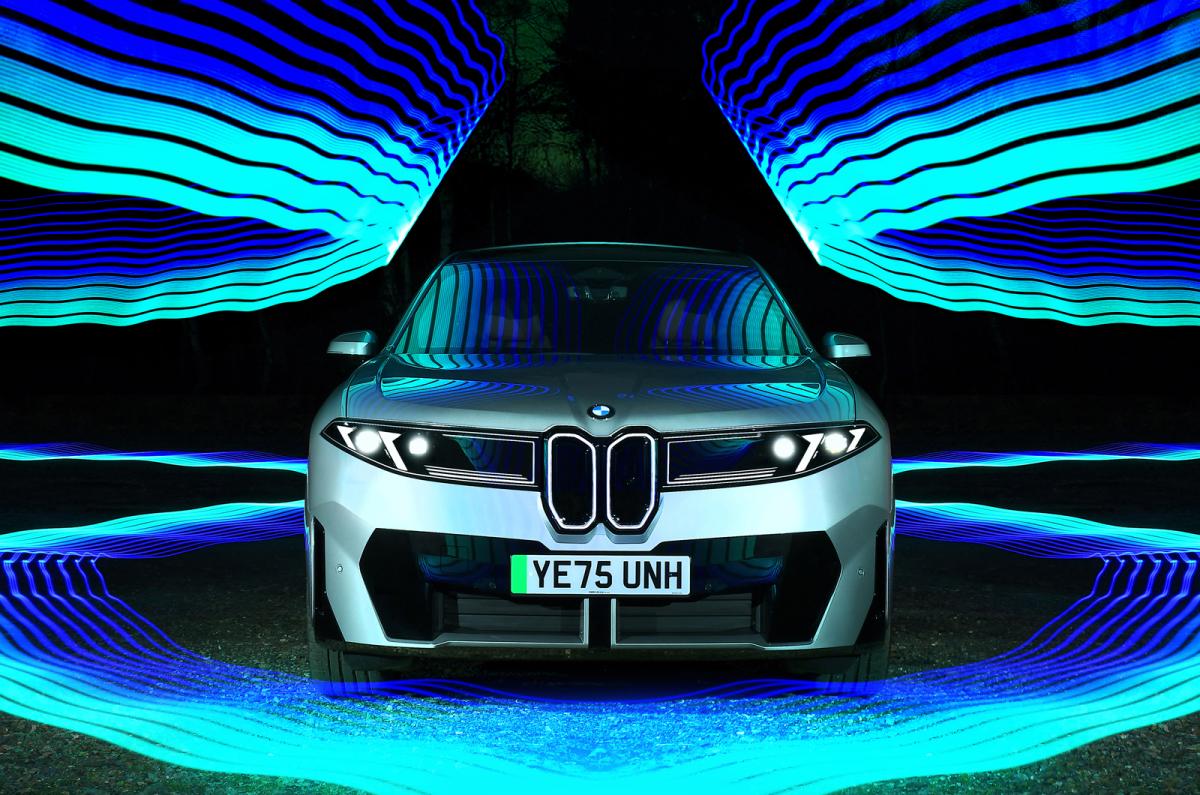 BMW iX3 nose static surrounded by light