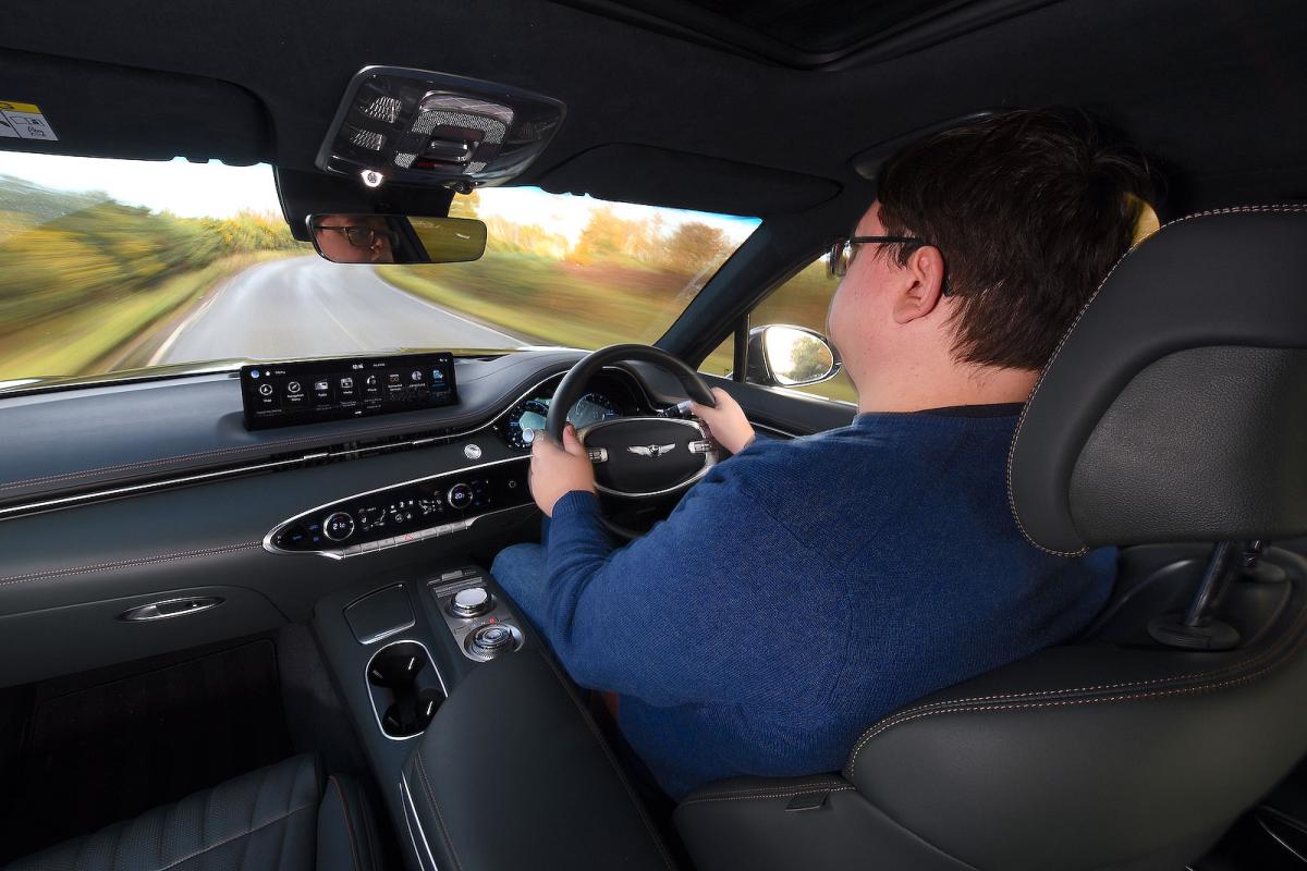 Darren Moss test driving Genesis GV70