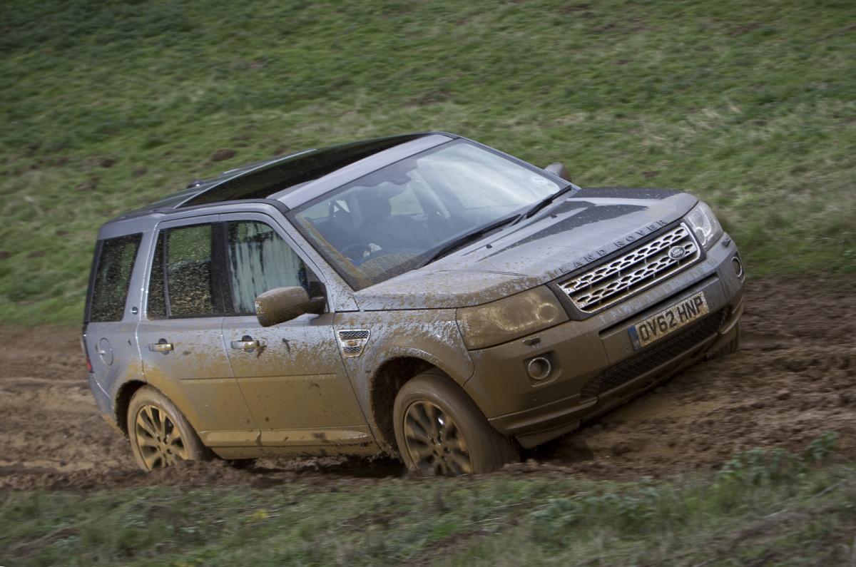 Land Rover Freelander front 3/4 up muddy hill