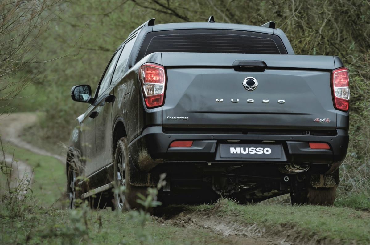KGM Musso driving rear