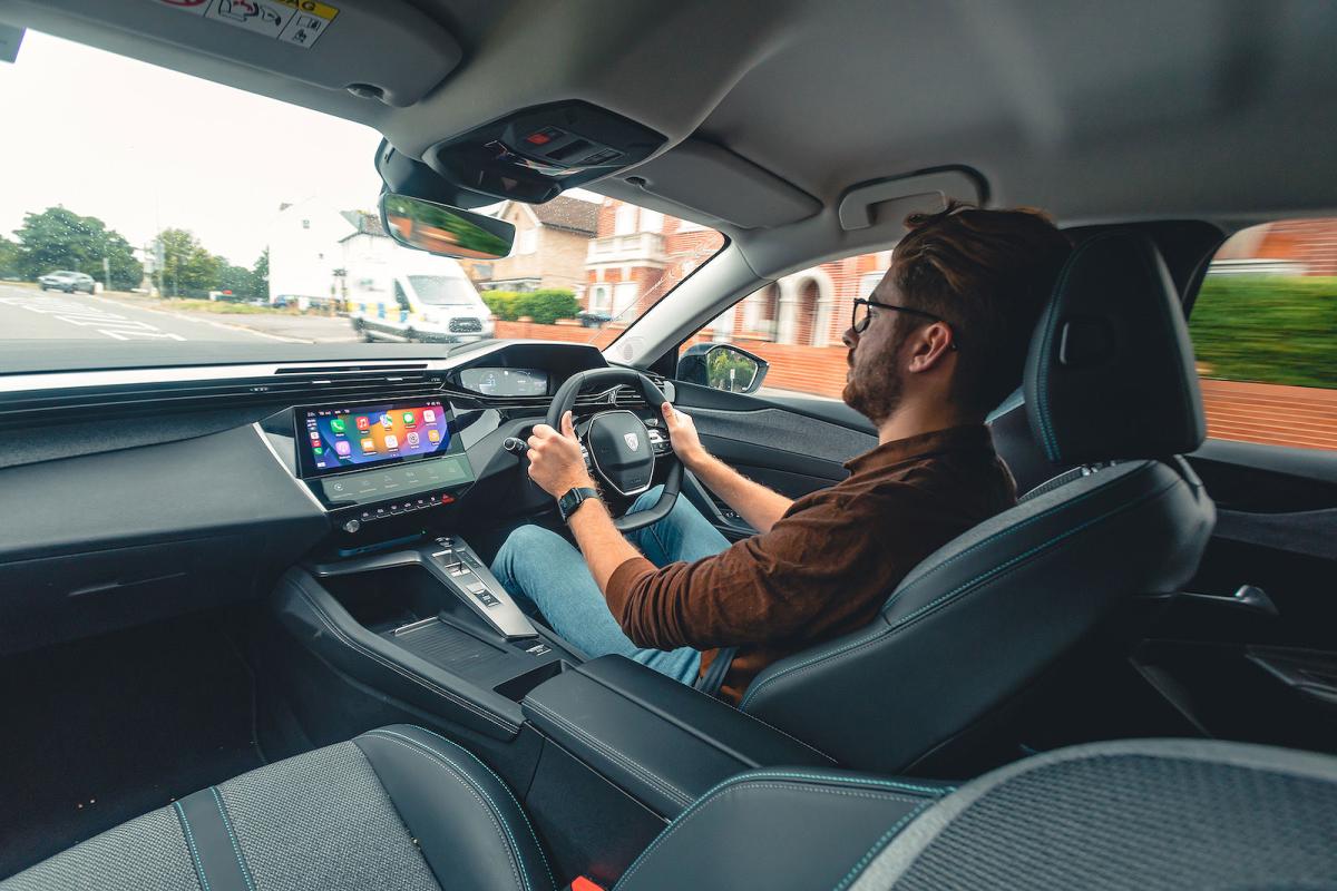 Kiall Garrett test driving Peugeot 308