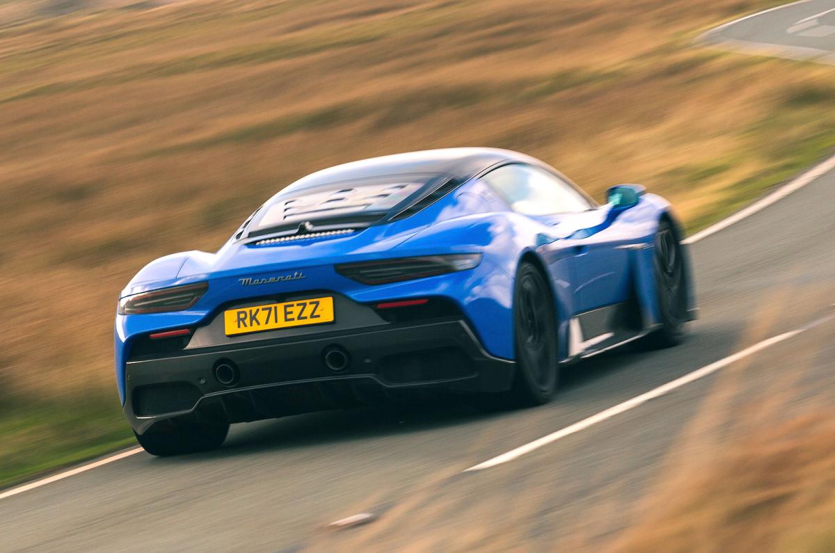 Blue Maserati MC20 rear right driving
