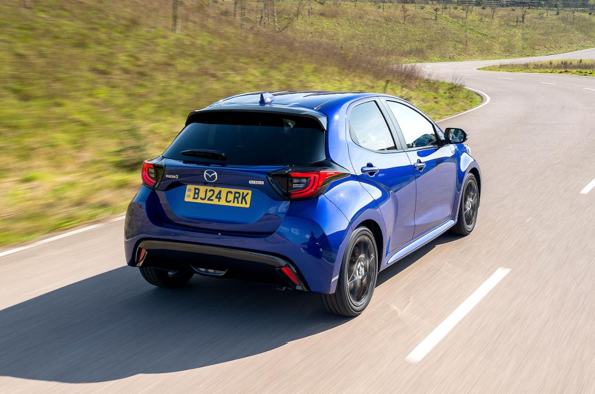 Blue Mazda 2 Hybrid rear right driving