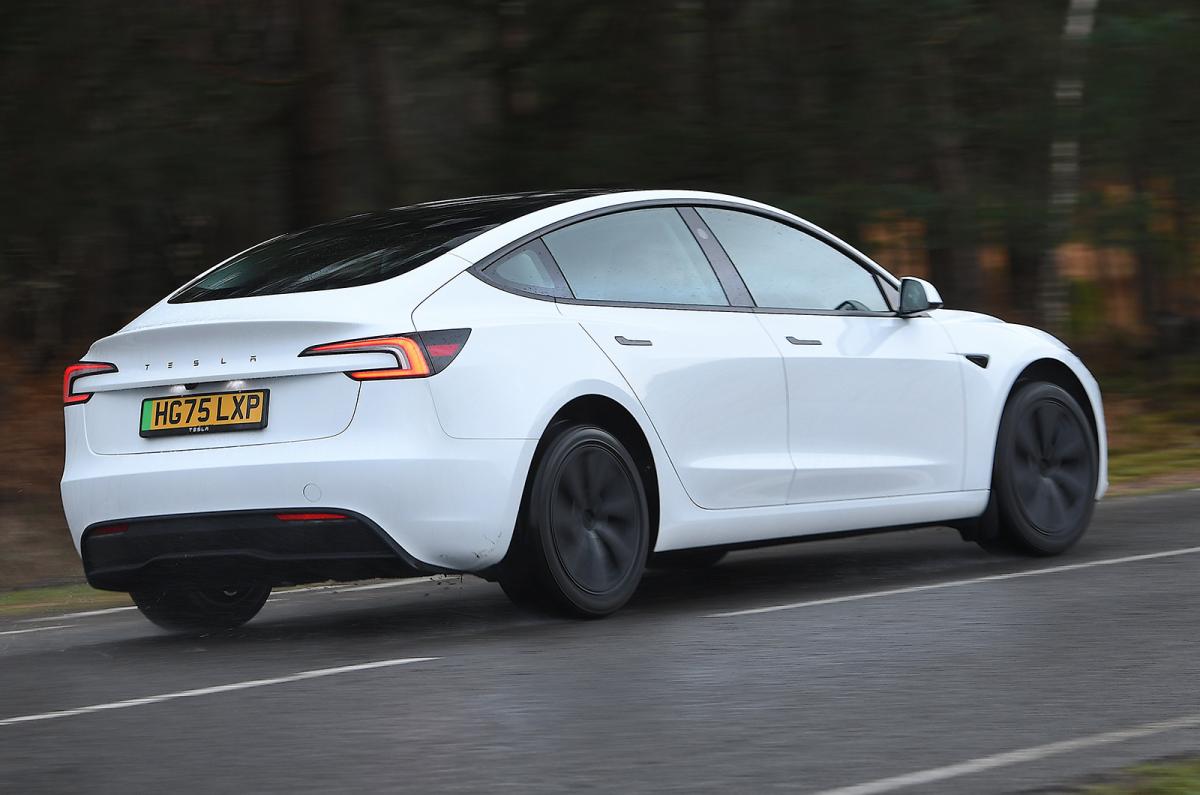 Tesla Model 3 driving rear right