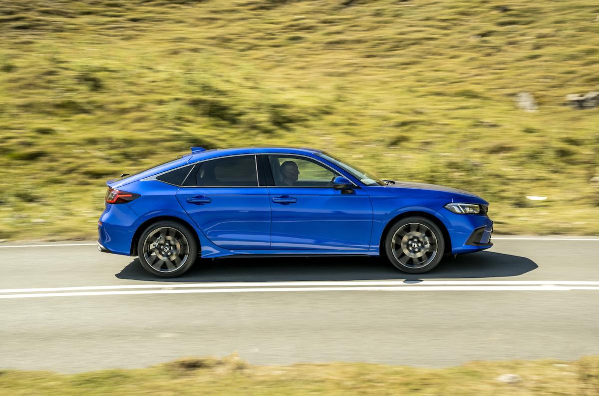Used Honda Civic 2022-present side driving blue
