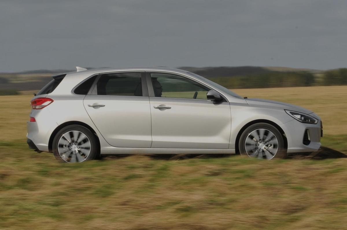 Used Hyundai i30 Hatchback 2017-present side driving silver