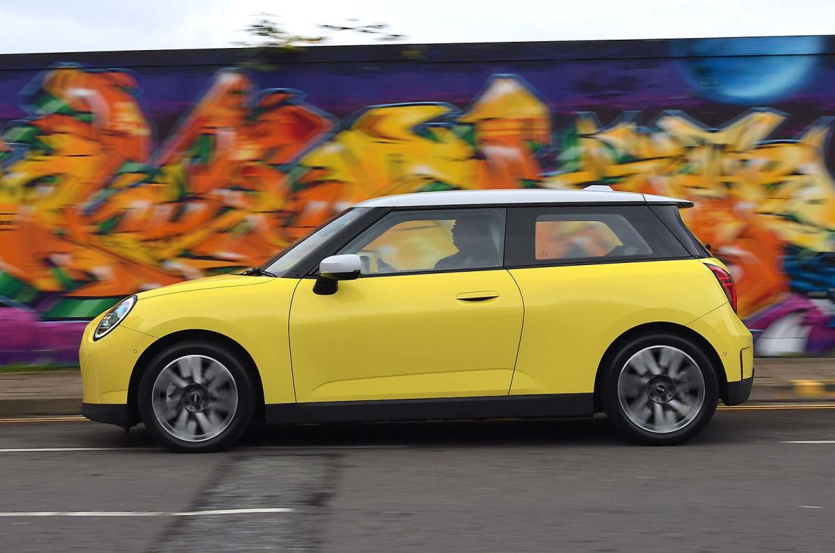 Used Mini Cooper Electric 2024-present side driving yellow