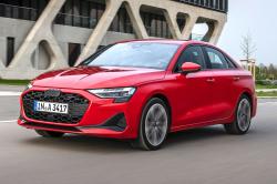 Red Audi A3 Saloon front left driving