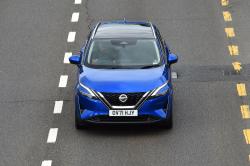 Blue Nissan Qashqai front driving