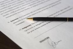 Close up of a pen on car insurance form