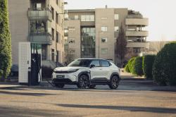 White Toyota Urban Cruiser charging in the city