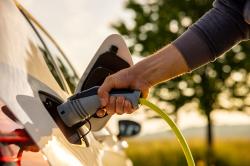 EV charging cable being plugged in