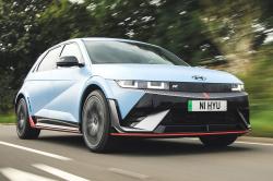 Orange Hyundai Ioniq 5 N front right driving
