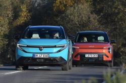 Kia EV3 following Nissan Leaf fronts