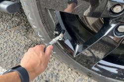 Land Rover Defender having a tyre pumped up
