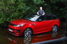 range_rover_sport_lt_parked_in_stream_with_person_poking_out_through_sunroof