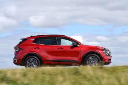 Red Kia Sportage right driving
